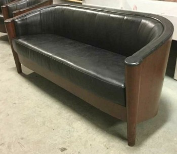 Furnishings, 1920s Style Leather Couch With Dark Cherry Stained Wood Backing., 69" W, 28" D, 30" H , Black, Brown, Leather, Wood, ART DECO